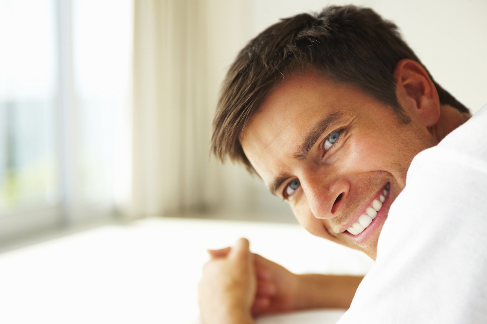 man smiling with dental crowns