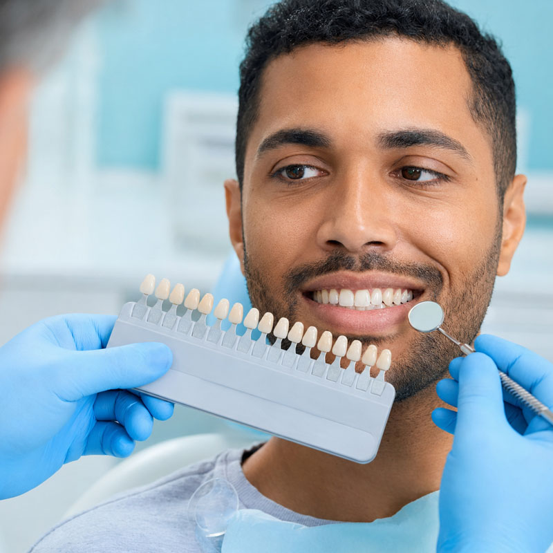 Patient smiling after cosmetic dental treatment